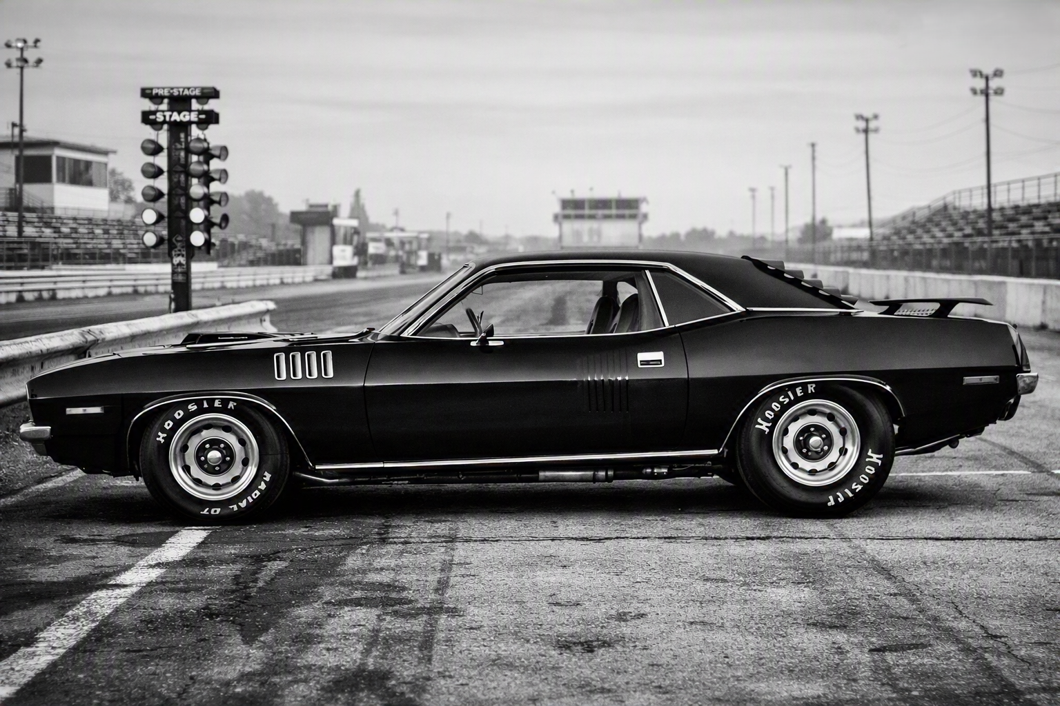 The Black Beast — 1971 Triple Black TX9 HemiCuda staged at the drag strip, Hoosier radials, Pre-Stage lights, ready to run