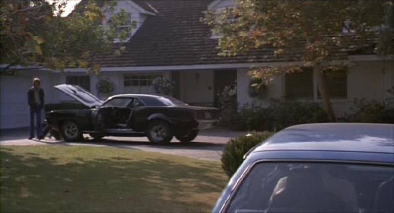 Phantasm I movie Cuda — hood up in a residential driveway, production still