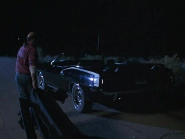 Reggie drags convertible top back to the Hemi after dislodging it on the highway.