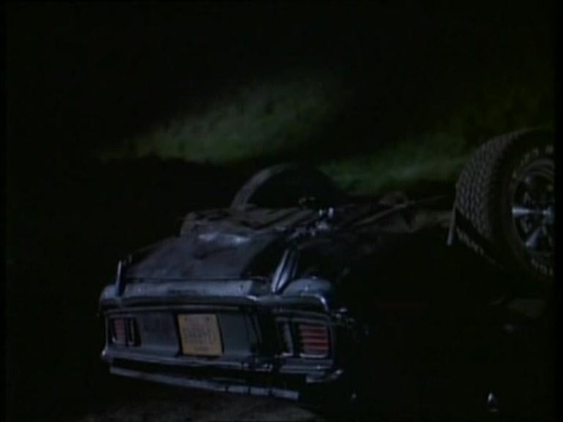 Phantasm II Cuda rolled at night — stunt wreck, post-crash aftermath