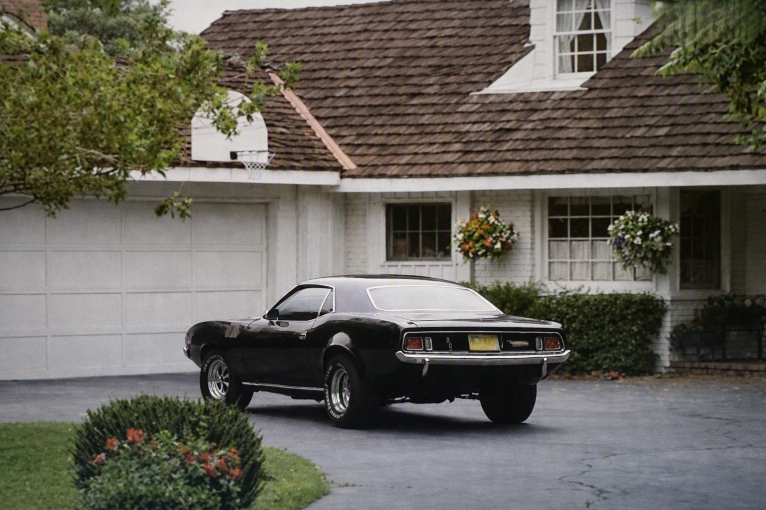 The original black 1971 Phantasm Cuda parked in a residential driveway
